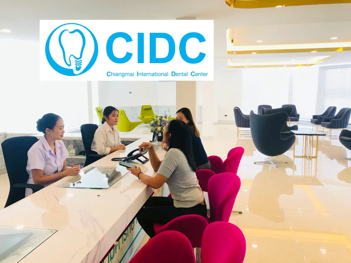 Reception desk with the CIDC logo above it and pink chairs in the waiting area